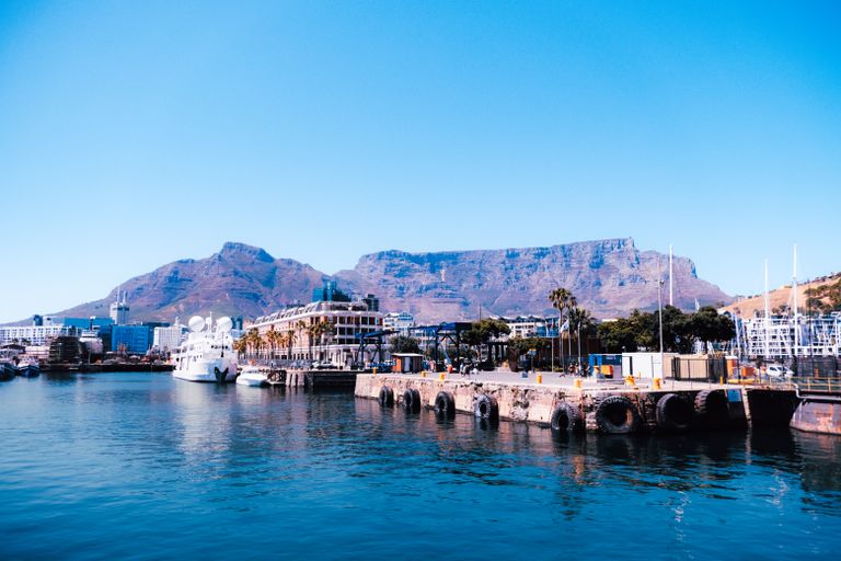 Vibrant image of Cape Town's waterfront with Table Mountain in the background.