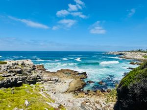 Beautiful view of the rocky coastline and waves in Hermanus, Western Cape.